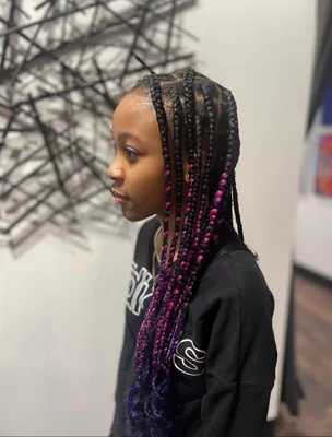 Woman with caramel and blonde ombre curly braids