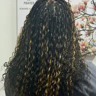 Box braids transitioning into curly ends
