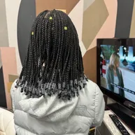 Box braids finished with clear beads