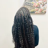 Box braids with loose curly ends