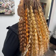Box braids with copper and blonde curly ombre ends