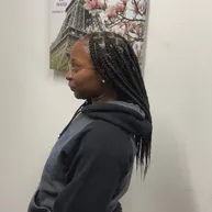 Cornrows flowing into a geometric zigzag braid pattern