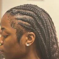 Cornrows flowing back into box braids