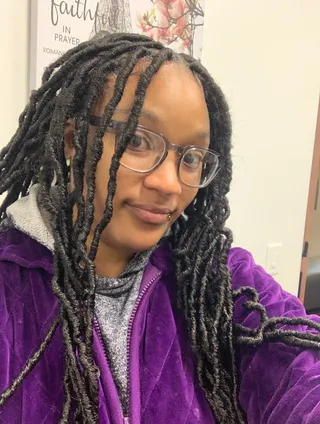 Tilani Brown wearing long dark twists